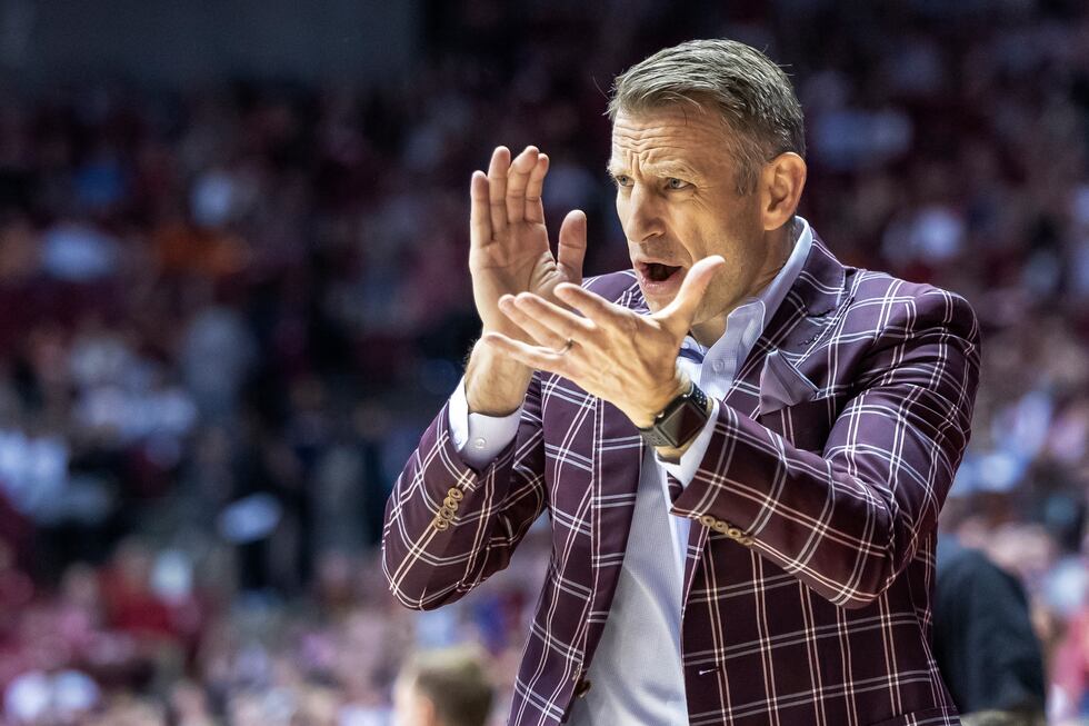 Alabama coach Nate Oats cheers during the first half of the team's NCAA college basketball...