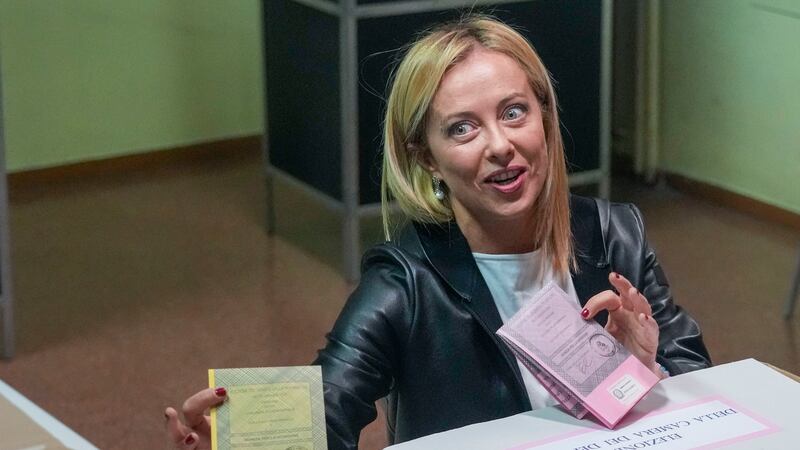 Far-right Brothers of Italy's leader Giorgia Meloni votes at a polling station in Rome,...