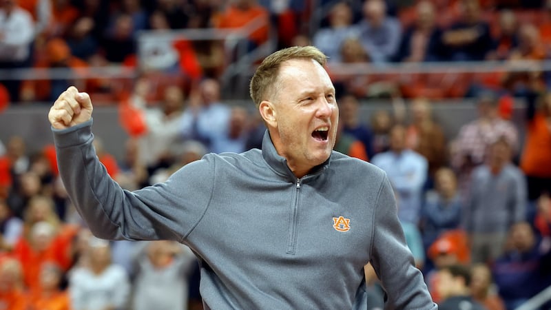 Auburn football coach Hugh Freeze is introduced during the first half of an NCAA college...