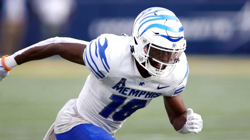 Memphis Tigers wide receiver Eddie Lewis (18) runs during an NCAA football game against the...