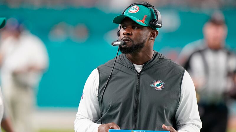 FILE - Then-Miami Dolphins coach Brian Flores stands on the sideline during the second half of...