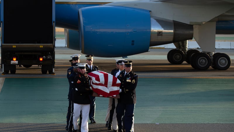 An armed forces color guard carries a casket containing the body of U.S. Sen. Dianne...