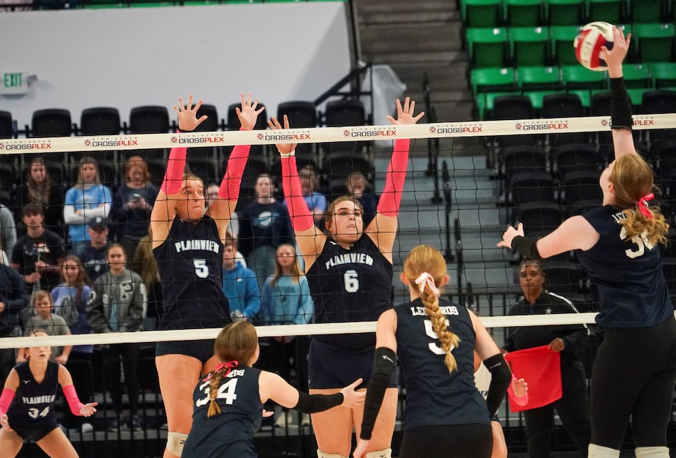 Plainview state tourney MVP Chloe Hatch (5) and Faith Odom (6) prepare to block a shot...