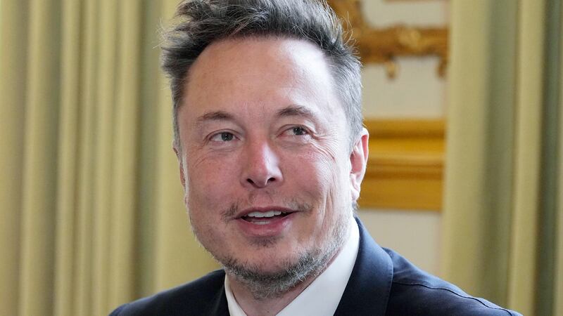 FILE - Twitter, now X Corp., and Tesla CEO Elon Musk poses prior to his talks with French...
