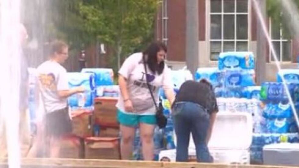 Volunteers supplied the homeless with water, bottles, hats and more. (Source: WAFF)