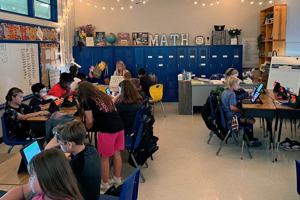 Piedmont Elementary School math teacher Cassie Holbrooks works with a small group of fourth...